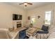 Comfortable living room features an electric fireplace, wood floors, and plenty of seating at 845 Hall Lane # B, Myrtle Beach, SC 29577