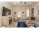 Comfortable living room with a fireplace, ceiling fan, neutral decor, and a sofa with striped upholstery at 845 Hall Lane # B, Myrtle Beach, SC 29577