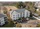 Aerial view of condo building with well manicured landscaping and ample parking at 901 West Port Dr. # 1611, North Myrtle Beach, SC 29582