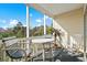Relaxing screened-in balcony with seating, providing a tranquil outdoor space with a view at 901 West Port Dr. # 1611, North Myrtle Beach, SC 29582