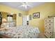 Cozy bedroom with a decorative seashell themed comforter, dresser and a ceiling fan at 901 West Port Dr. # 1611, North Myrtle Beach, SC 29582