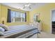Inviting bedroom with a full size bed, a fan, and a bright window at 901 West Port Dr. # 1611, North Myrtle Beach, SC 29582