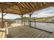Covered dock area with string lights, bench seating and views of the waterway at 901 West Port Dr. # 1611, North Myrtle Beach, SC 29582