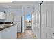A view of the kitchen area with light blue walls and entry to the outside at 901 West Port Dr. # 1611, North Myrtle Beach, SC 29582