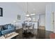 Inviting living area with a comfortable sofa, dining table, and a partial view of the kitchen at 901 West Port Dr. # 1611, North Myrtle Beach, SC 29582