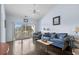 Cozy living room with plush seating, balcony access, and vaulted ceiling at 901 West Port Dr. # 1611, North Myrtle Beach, SC 29582