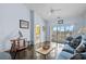 Spacious living room showcasing natural light, balcony, and comfortable seating arrangement at 901 West Port Dr. # 1611, North Myrtle Beach, SC 29582