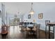 Bright living room featuring high ceilings, hardwood floors, and sliding glass doors to a balcony at 901 West Port Dr. # 1611, North Myrtle Beach, SC 29582