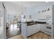 Open concept kitchen and living space with natural light and modern appliances at 901 West Port Dr. # 1611, North Myrtle Beach, SC 29582