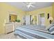 Bright main bedroom with a queen bed, ceiling fan, and ensuite bathroom at 901 West Port Dr. # 1611, North Myrtle Beach, SC 29582