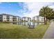 Scenic view of condo buildings surrounding a tranquil pond with a fountain feature at 901 West Port Dr. # 1611, North Myrtle Beach, SC 29582