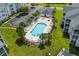 Aerial view of the community pool and hot tub surrounded by palm trees at 901 West Port Dr. # 1611, North Myrtle Beach, SC 29582