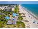 A breathtaking aerial shot capturing a beachside resort with multiple pools and access to the sandy shore at 915 Preservation Circle, Pawleys Island, SC 29585
