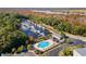An aerial view of a marina and clubhouse next to a pool overlooking the river at 915 Preservation Circle, Pawleys Island, SC 29585