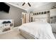 Nicely decorated bedroom with large bed, shelves and cabinets for storage, and a TV mounted on the wall at 915 Preservation Circle, Pawleys Island, SC 29585