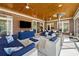 Entertain on this expansive covered patio, featuring brick accents and comfortable seating areas at 915 Preservation Circle, Pawleys Island, SC 29585