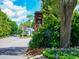 Community entrance displaying the neighborhood's sign amid lush greenery and a well-maintained landscape at 915 Preservation Circle, Pawleys Island, SC 29585