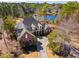Beautiful brick house featuring a circular driveway, lush landscaping and situated near a tranquil lake at 915 Preservation Circle, Pawleys Island, SC 29585