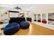 Game room with movie screen, recliners, bean bag chairs, kitchenette, and built-in storage at 915 Preservation Circle, Pawleys Island, SC 29585