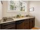 Kitchenette featuring granite countertops, dark wood cabinets, a small cooktop and a mini fridge at 915 Preservation Circle, Pawleys Island, SC 29585