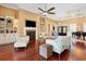 Bright living room with hardwood floors, fireplace, large windows and a view of the home's entryway at 915 Preservation Circle, Pawleys Island, SC 29585