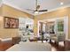 Spacious living room with hardwood floors, high ceilings, fireplace, access to porch, and an open-concept design at 915 Preservation Circle, Pawleys Island, SC 29585