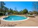 Beautiful backyard pool and hot tub with deck chairs and landscaping at 915 Preservation Circle, Pawleys Island, SC 29585