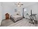 Bedroom with ceiling fan, hardwood floors, and large window at 945 Castlewood Dr., Conway, SC 29526