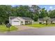 Charming single-story home with a lush green lawn and a well-manicured landscape at 945 Castlewood Dr., Conway, SC 29526