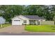Charming single-story home with a lush green lawn and a well-manicured landscape at 945 Castlewood Dr., Conway, SC 29526