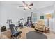 Home gym featuring multiple workout machines, a weight bench, and a comfortable reading chair at 945 Castlewood Dr., Conway, SC 29526