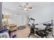 Home gym with exercise bike, weight bench, and a cozy chair for relaxing post-workout at 945 Castlewood Dr., Conway, SC 29526