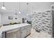 Open-concept kitchen with stainless appliances, gray cabinets, tiled floors, and eat-in island at 945 Castlewood Dr., Conway, SC 29526