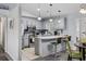 Updated kitchen with stainless steel appliances, breakfast bar, tile floor, and neutral color scheme at 945 Castlewood Dr., Conway, SC 29526