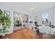 Bright office with hardwood floors, desk, backyard views, and open connection to the kitchen at 945 Castlewood Dr., Conway, SC 29526