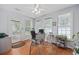 Bright office featuring hardwood floors, ample natural light from multiple windows, and backyard access at 945 Castlewood Dr., Conway, SC 29526