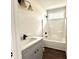 Bathroom with a white tub shower and a vanity with a white countertop and black faucet at 2212 Old Charleston Rd., Georgetown, SC 29440