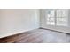 Bedroom features luxury vinyl flooring and a bright window at 2212 Old Charleston Rd., Georgetown, SC 29440