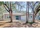 Single story home featuring a white garage door and sliding glass door at 2212 Old Charleston Rd., Georgetown, SC 29440