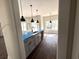 Kitchen island with a stainless steel sink, pendant lights, and an open view of the home at 2212 Old Charleston Rd., Georgetown, SC 29440