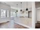 Open kitchen area ready for customization, with light gray cabinetry and modern pendant lighting at 2212 Old Charleston Rd., Georgetown, SC 29440