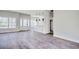 Open-concept living space featuring wood-look floors, natural light, and easy flow to the kitchen at 2212 Old Charleston Rd., Georgetown, SC 29440