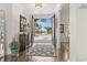Bright foyer with hardwood floors, elegant furnishings, and a view to the exterior at 1012 Dowitcher Dr., Conway, SC 29526