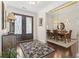 Elegant foyer showcasing the dark wood door and adjacent dining room at 1012 Dowitcher Dr., Conway, SC 29526