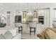 Kitchen with white cabinets, stainless steel appliances, and breakfast bar at 1012 Dowitcher Dr., Conway, SC 29526