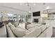 Bright living room with a fireplace, built-in shelving, and lake views at 1012 Dowitcher Dr., Conway, SC 29526
