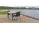 Outdoor dining set near the lake offering beautiful views at 1012 Dowitcher Dr., Conway, SC 29526
