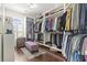 Spacious walk-in closet with ample shelving, hanging racks, and a center ottoman at 1012 Dowitcher Dr., Conway, SC 29526