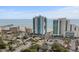 Aerial view of oceanfront resort, pier, beach and ample parking at 107 S Ocean Blvd. # 2106, Myrtle Beach, SC 29577