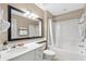 Clean bathroom with a white vanity, a framed mirror, and a shower-tub combination at 107 S Ocean Blvd. # 2106, Myrtle Beach, SC 29577